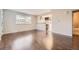 Open-concept living space with wood flooring connecting the living area to the kitchen and bathroom at 1021 Stuart St, Denver, CO 80204