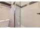 Modern shower with glass door, tiled walls, and black accent stripe at 1021 Stuart St, Denver, CO 80204