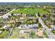 Aerial view highlighting the property's layout with mature trees near open green space at 6212 S Pennsylvania St, Centennial, CO 80121