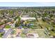 Wide aerial shot showing the property nestled within a lush, tree-lined neighborhood near urban settings at 6212 S Pennsylvania St, Centennial, CO 80121