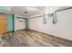 Finished basement with modern floors, storage, and window views at 6212 S Pennsylvania St, Centennial, CO 80121