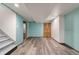 Finished basement features stylish flooring, blue accent walls, and ample closet space at 6212 S Pennsylvania St, Centennial, CO 80121