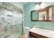 Updated bathroom with tile shower, new vanity and modern fixtures at 6212 S Pennsylvania St, Centennial, CO 80121