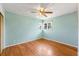 This bedroom offers hardwood floors and a light-filled space with a ceiling fan at 6212 S Pennsylvania St, Centennial, CO 80121