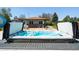 Inviting hot tub with a retractable cover, perfect for relaxation, on a wooden deck at 6212 S Pennsylvania St, Centennial, CO 80121