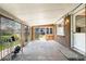 Bright sunroom with multiple windows and door to the backyard at 6212 S Pennsylvania St, Centennial, CO 80121