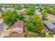 Aerial view highlights the property's location, lush backyard, garden and mature trees at 9832 High St, Thornton, CO 80229