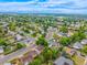 Aerial view of a quiet neighborhood featuring well-kept houses, verdant trees, and curved streets at 9832 High St, Thornton, CO 80229