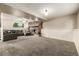 Finished basement area features a comfortable seating area and stone fireplace at 9832 High St, Thornton, CO 80229