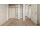 Basement space featuring open closet area and neutral carpet at 9832 High St, Thornton, CO 80229