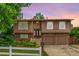 Charming split level home featuring a two car garage, and a well-maintained yard at 9832 High St, Thornton, CO 80229