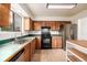 Kitchen featuring tile floors, stainless steel appliances, and lots of cabinet space at 9832 High St, Thornton, CO 80229