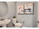 Cozy powder room with modern fixtures, and decorative accents at 485 Bennett Ave, Bennett, CO 80102