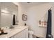 Bright bathroom featuring a modern vanity with marble countertop and stylish fixtures at 485 Bennett Ave, Bennett, CO 80102