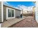 Charming backyard patio with seating area, stone accents, and a sliding door entrance at 5761 W 71St Ave, Arvada, CO 80003