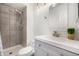 Modern bathroom featuring gray-scale tile and updated fixtures at 5761 W 71St Ave, Arvada, CO 80003