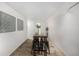 Cozy dining area featuring a bar table, four chairs, and stylish wall decor at 5761 W 71St Ave, Arvada, CO 80003