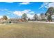 A grassy community park, complete with benches, trees, and a few patches of snow on the ground at 5761 W 71St Ave, Arvada, CO 80003