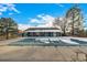 A covered community pool with a light blue building and a few patches of snow on the roof at 5761 W 71St Ave, Arvada, CO 80003