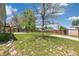 Expansive backyard features a lush lawn, storage shed, and perimeter fence at 5886 S Nepal Way, Centennial, CO 80015