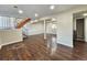 Spacious basement with hardwood floors and stairs leading to another level, showing washing machine at 5886 S Nepal Way, Centennial, CO 80015