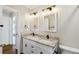Beautifully updated bathroom with double sinks and modern fixtures at 5886 S Nepal Way, Centennial, CO 80015