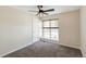 Comfortable bedroom with carpet flooring, a ceiling fan, and a bright window at 5886 S Nepal Way, Centennial, CO 80015