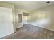 Empty bedroom with carpet, closet space, neutral paint, and standard door at 5886 S Nepal Way, Centennial, CO 80015