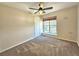 Cozy bedroom with a ceiling fan, window, and neutral carpet at 5886 S Nepal Way, Centennial, CO 80015