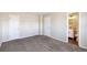 Spacious carpeted bedroom with access to an ensuite bathroom at 5886 S Nepal Way, Centennial, CO 80015