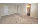 Spacious bedroom with neutral carpet, two closets, and an ensuite bathroom at 5886 S Nepal Way, Centennial, CO 80015