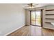 Dining room featuring hardwood floors, a ceiling fan, and sliding glass doors to a balcony at 5886 S Nepal Way, Centennial, CO 80015