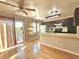 Eat-in kitchen with dark cabinets, light countertops, and hardwood floors at 5886 S Nepal Way, Centennial, CO 80015