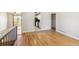 Hardwood floors transition into an open layout leading from living space to the well-lit kitchen at 5886 S Nepal Way, Centennial, CO 80015