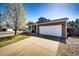 Charming home with a front porch, a two-car garage, and a driveway at 2070 E 125Th Pl, Thornton, CO 80241