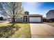 Charming single-Gathering home with a blossoming tree and well-kept front lawn at 2070 E 125Th Pl, Thornton, CO 80241