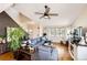 Comfortable living room featuring a sectional couch, hardwood floors, and natural light at 2070 E 125Th Pl, Thornton, CO 80241