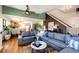 Open-concept living room with hardwood floors and a glimpse into the kitchen at 2070 E 125Th Pl, Thornton, CO 80241