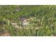 Secluded home with a wooded backdrop at 80 Castlewood Ct, Evergreen, CO 80439