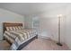 Cozy bedroom with soft carpet, natural light, and simple furnishings for relaxation at 80 Castlewood Ct, Evergreen, CO 80439