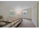 Neutral bedroom with carpet, two windows, a double door closet, and minimalist décor at 80 Castlewood Ct, Evergreen, CO 80439