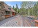 Large deck features a hammock and mountain views at 80 Castlewood Ct, Evergreen, CO 80439