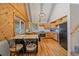 This kitchen has light wood cabinets, stainless steel appliances, and a breakfast bar at 80 Castlewood Ct, Evergreen, CO 80439