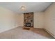 Cozy living room features a stone fireplace and neutral carpet at 80 Castlewood Ct, Evergreen, CO 80439