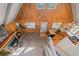 Aerial view of the home with a fireplace, wood paneled ceiling, and kitchen at 80 Castlewood Ct, Evergreen, CO 80439