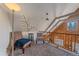 Upstairs loft area with seating and views of the living room at 80 Castlewood Ct, Evergreen, CO 80439