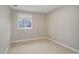 Neutral bedroom with a window view and plush carpet at 6389 S Ponds Way, Littleton, CO 80123