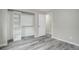 Spacious bedroom with luxury vinyl plank flooring and built-in closet shelving at 6389 S Ponds Way, Littleton, CO 80123