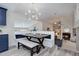 Bright dining area with a bench, table, and stylish lighting fixtures at 6389 S Ponds Way, Littleton, CO 80123