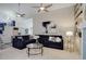 Bright living room with vaulted ceilings, ceiling fans, and comfortable seating at 6389 S Ponds Way, Littleton, CO 80123